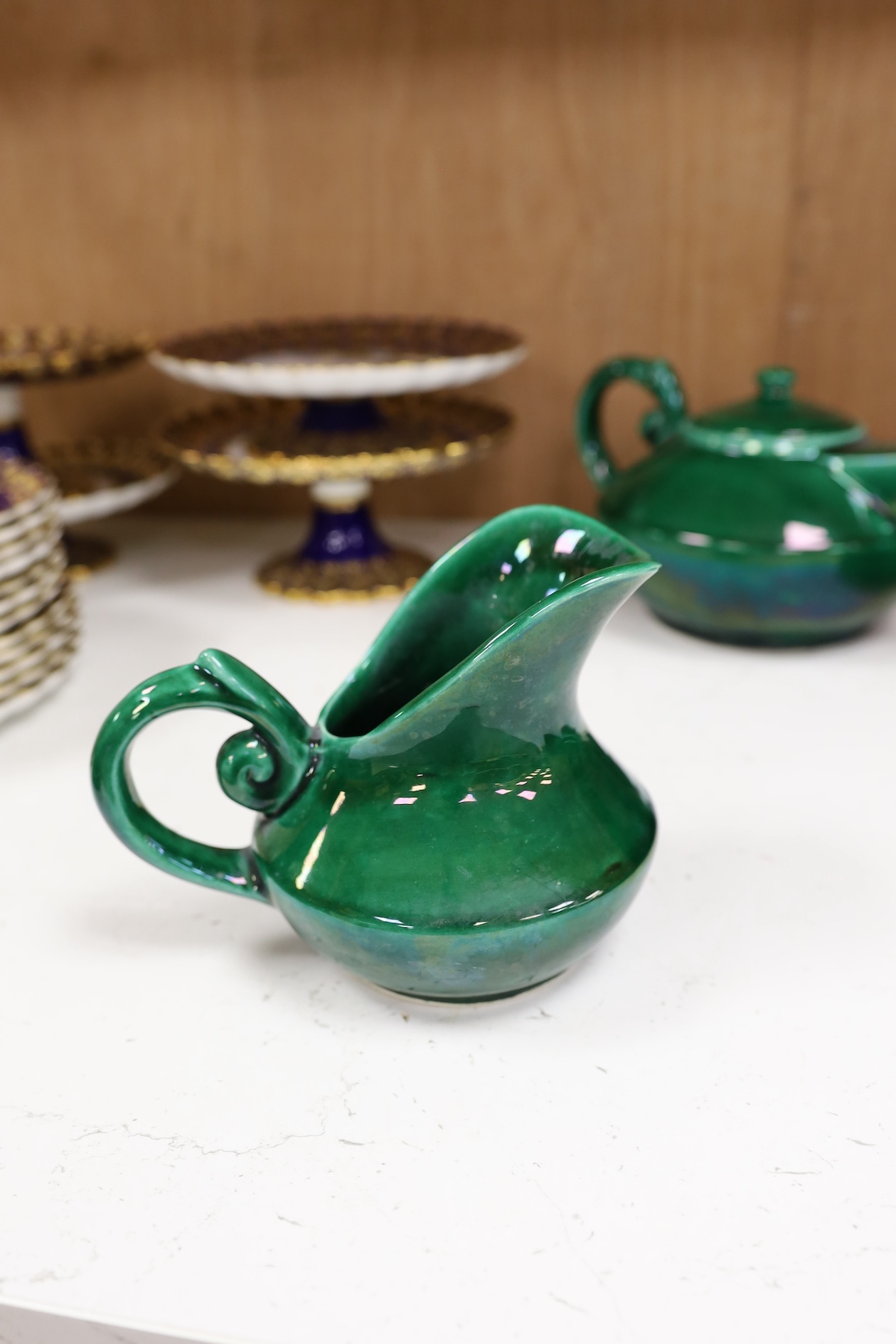 A Vallauris French bright green tea service, with six cups saucers milk jug and tea pot, jug 12.5cm high. Condition - fair to good